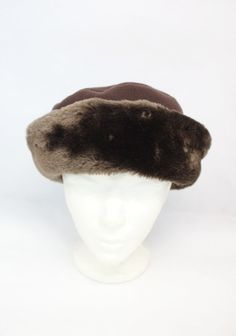 BEAUTIFUL & VERY STYLISH BROWN FAUX FUR & FLEECE HAT FOR WOMEN!  THIS ITEM IS PRE-OWNED: THE FAUX FUR, THE FLEECE AND THE LINING ARE "EXCELLENT", THE BEST CONDITION POSSIBLE! MEASUREMENTS:   SIZE: 22.5" AFTER BUYING THIS ITEM, IT WOULD BE VERY MUCH APPRECIATED IF YOU COULD PROVIDE YOUR HEAD CIRCUMFERENCE INCLUDING THE TIP OF EARS, SO WE CAN ADJUST THE HAT TO YOUR SIZE ACCORDINGLY. THANK YOU! :) A10632 Oliverfurs 9250 Parc Ave. #204, Montreal, Quebec, H2N 1Z2, Canada www.oliverfurswholesale.com oliver@oliverfurswholesale.com Toll free: 1-866-845-9997 International: 1-514-845-9997 Brimmed Felt Hat For Winter, Winter Felt Hat For Outdoor, Brown Short Brim Hat For Cold Weather, One Size Winter Felt Hat, Fitted Brown Hat For Cold Weather, Classic Felt Cap For Winter, Fitted Brown Hats For Cold Weather, Winter Fur Felt Hats For Cold Weather, Brown Brimmed Hat For Cold Weather