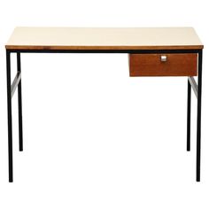 a white desk with a wooden drawer on it's left side and black legs