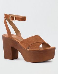 This platform sandal features a rich suede upper, buckle closure at the ankle and a criss cross front. A must-wear with everything from jeans to dresses! Bridal Party Shoes, Wood Platform Heels, Wooden Platform Sandals, Heel Sandals Outfit, Wood Heel, Shoes Heels Wedges, Heeled Sandal, Wooden Heel, Platform Heel