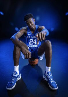 a basketball player is sitting on the floor