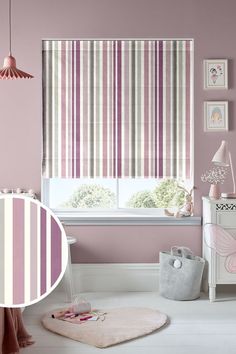 a room with pink walls and striped blinds