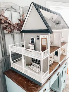 a doll house on top of a table