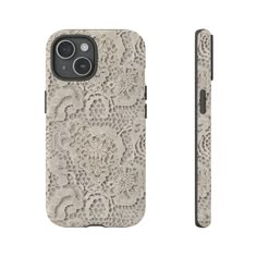 an iphone case with white lace on the back and side, in front of a white background