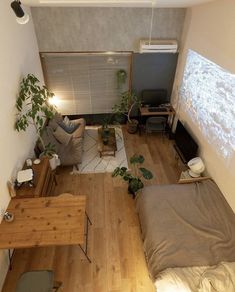 an overhead view of a living room with wood flooring and furniture, including a couch