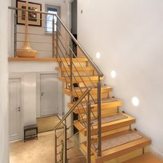 the stairs are made of wood and have metal handrails