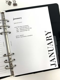 a black and white book with the word january written on it