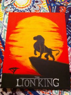 the lion king movie poster is displayed on a colorful background with an orange and yellow sun