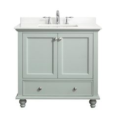 a bathroom vanity with two drawers and a sink on top of the cabinet is shown