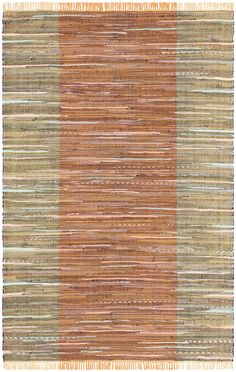 an orange and brown rug with vertical stripes on it, in the middle of a white background