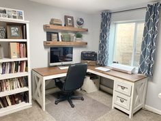 a home office with bookshelves, desk and computer