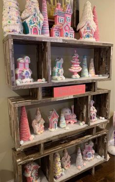 a shelf filled with lots of different types of cakes and cupcakes on top of it