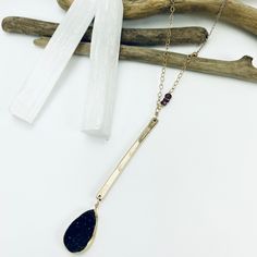 Shimmer in the moonlight with this elegant druzy necklace. Black druzy drops from hand forged gold bar which is accented by mixed metal chains, rhodolite garnet and turquoise gemstones. Available in lengths: 16”-32” Pendant Length: 2.75” 14k gold filled and sterling silver Black druzy, rhodolite garnet and truquoise Druzy Necklace, Rhodolite Garnet, Necklace Black, Jewelry Repair, Gold Bar, Turquoise Gemstone, Hand Forged, Metal Chain, Semi Precious Gemstones