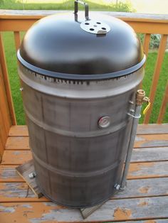 a big barrel sitting on top of a wooden deck