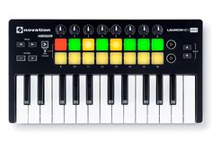 an electronic keyboard with many different colors on the top and bottom keys, in front of a white background