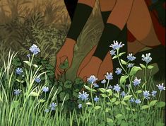 a woman kneeling down in the grass picking flowers