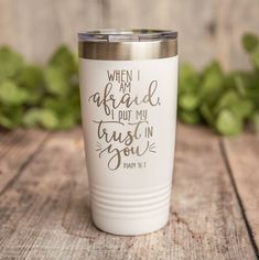 a white tumbler with the words when i am afraid to put my trust in you