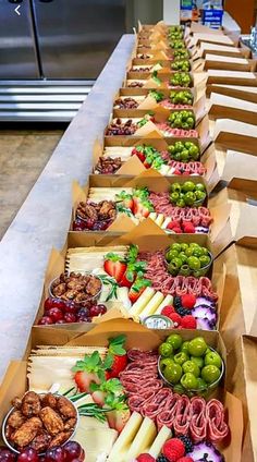 several boxes filled with different types of food sitting on top of a counter next to each other