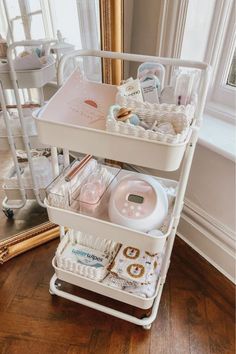 a three tiered cart filled with personal care items