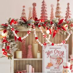 a christmas display with candy canes and candies on the shelf in front of it