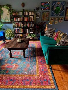 a living room filled with furniture and lots of books