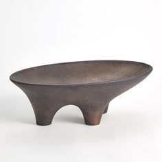 a black bowl sitting on top of a white table