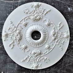 a white plate with an ornate design on it