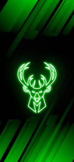 the deer head is glowing green in the dark