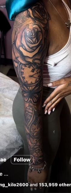 a woman with tattoos on her arm and leg