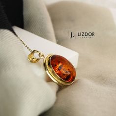 ▶ 𝙋𝙍𝙊𝘿𝙐𝘾𝙏 𝙁𝙀𝘼𝙏𝙐𝙍𝙀𝙎 * 14k Yellow Gold Amber Necklace * Amber Stone Size: 1.25 cm x 1.74 cm (0.49 x 0.68 in) * Amber Necklace Width: 1.66cm( 0.65 in) * Amber Necklace Lenght: 2.49 cm( 0.98 in) * Amber Necklace Height : 7.80 mm( 0.30 in) * Available in 5 different chain lengths: 42cm (16.5 in), 44cm (17.3 in), 46cm (18.1 in), 48 cm (18.8 in), 50 cm ( 19.6 in) ✔️ Made of real amber stone. Since amber stone is made of natural stone, there may be differences in the colors of the stone. Affordable Amber Necklace For Gifts, Luxury Gold Baltic Amber Jewelry, Cheap Amber Necklaces For Gifts, Luxury Elegant Baltic Amber Necklaces, Luxury Amber Necklace For Wedding, Luxury Antique Amber Necklace, Luxury Elegant Amber Crystal Necklaces, Formal Oval Amber Necklace, Heirloom Oval Pendant Jewelry With Cabochon