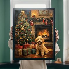 a person holding up a painting with a dog in front of a christmas tree and presents