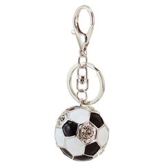 a key chain with a soccer ball hanging from it's center loop, on a white background