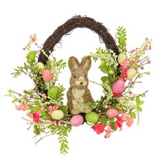 a bunny sitting in the middle of a wreath