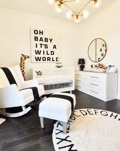 a baby's room with black and white decor