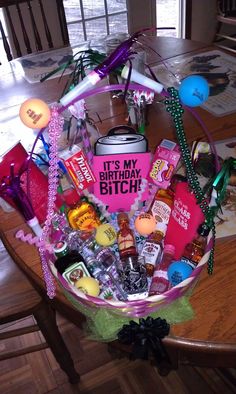 a birthday gift basket is sitting on a table