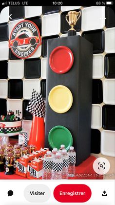 a table topped with plates and cups next to a traffic signal sign on top of a counter