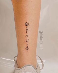 a woman's leg with a tattoo on it and an anchor in the middle