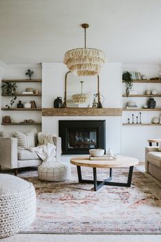 a living room filled with furniture and a fire place