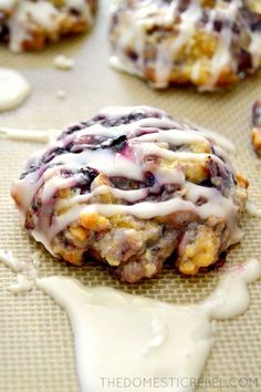 blueberry cheesecake cookies are drizzled with icing