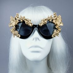 Hand-decorated black & gold filigree ornate sunglasses featuring Ganesh. Please note: There is no ready-made sunglasses box large enough for these sunglasses. These sunglasses are wearable art and need to be treated with due care. While i have taken every possible care to make them sturdy throwing them in a bag careless may damage them. Treat them as you would a precious thing... Approx measurements: Inner arm to arm: 13cm Total width: 16cm Approx Weight: 42g Thank you in advance for not PM' Gold Cat Eye Sunglasses With Mirrored Lenses For Party, Gold Mirrored Cat Eye Sunglasses For Party, Gold Mirrored Lenses Cat Eye Sunglasses For Party, Luxury Gold Cat Eye Sunglasses For Party, Gold Mirrored Sunglasses For Party, Luxury Gold Cat Eye Sunglasses For Evening, Gold Mirrored Lenses Sunglasses For Party, Elegant Gold Cat Eye Sunglasses For Evening, Gold Sunglasses With Gradient Lenses For Festivals