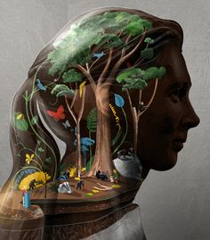 a man's head with trees and animals on it