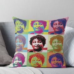 a throw pillow with the faces of different people on it