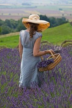 a woman standing in a lavender field holding a basket with the words be who god wants you, be, not what others on the world would want to be