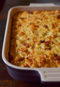 a casserole dish with cheese and bacon in it