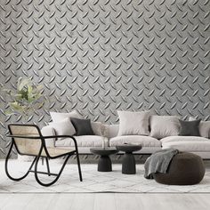 a living room filled with furniture next to a wall covered in metallic fish scale tiles