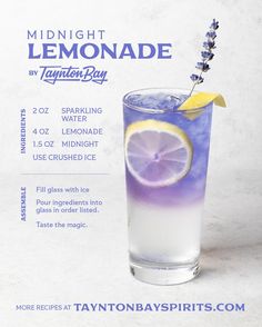 a drink with lemon and lavender on the rim is shown in front of a white background