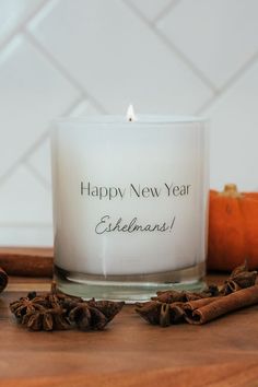 white glass candle that reads, "happy new year Eshelmans!" Gift For New Year, Holiday Candles, Candle Gift Set, Neighbor Gifts