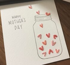 a mothers day card with hearts in a jar