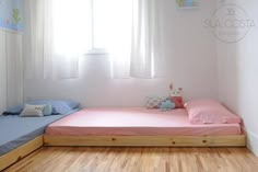 a small child's room with a bed and window