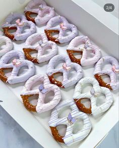 a box filled with lots of pretzels sitting on top of a counter next to each other