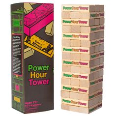 a stack of wooden blocks sitting next to a cardboard box with the word power hour on it